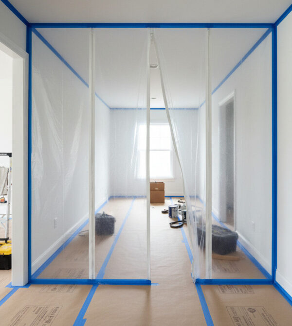 MOSAIC Design Build crew installing dust barriers to protect client’s home during remodel